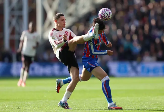 Florian Wirtz of Liverpool battles for possession