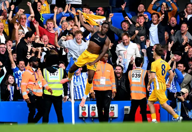 Brighton's English striker #18 Danny Welbeck celebrates scoring the team's third goal