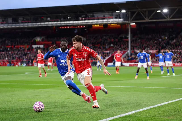 Neco Williams of Nottingham Forest is challenged by Arthur Masuaku of Sunderland