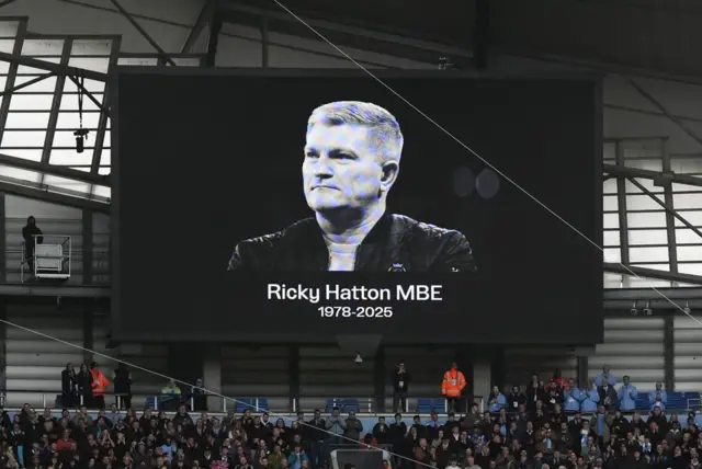 A screen showing an image of Ricky Hatton and his year of birth and death at Etihad Stadium
