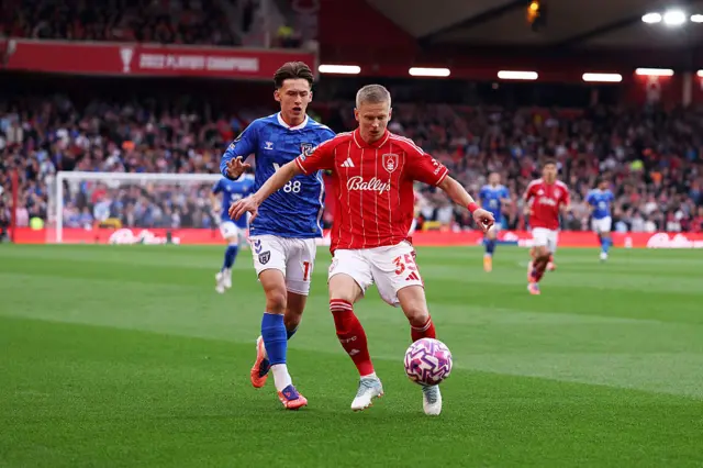 Oleksandr Zinchenko of Nottingham Forest is challenged by Chris Rigg of Sunderland during the Premier League match between Nottingham Forest and Sunderland at City Ground on September 27, 2025 in Nottingham, England.