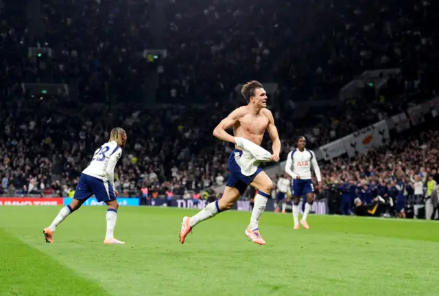 Tottenham Hotspur's Portugese midfielder #06 Joao Palhinha celebrates scoring the team's first goal