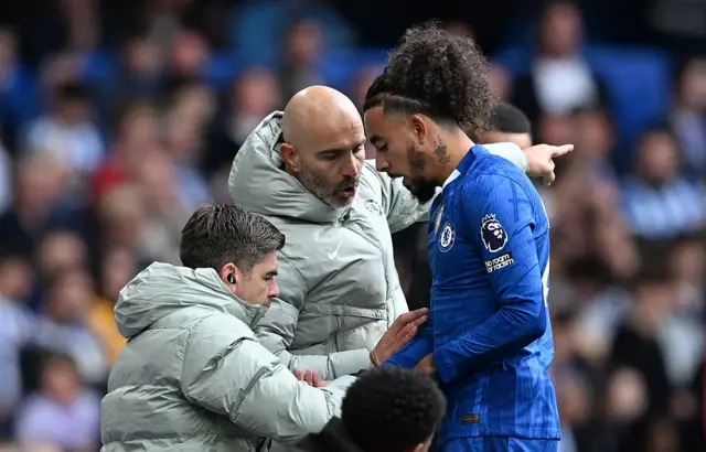 Enzo Maresca, Manager of Chelsea, gives instructions to Malo Gusto of Chelsea during the Premier League match between Chelsea and Brighton & Hove Albion at Stamford Bridge on September 27, 2025 in London, England.