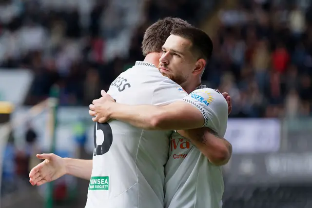 Zan Vipotnik of Swansea City (R) celebrates his goal with Cameron Burgess (L)