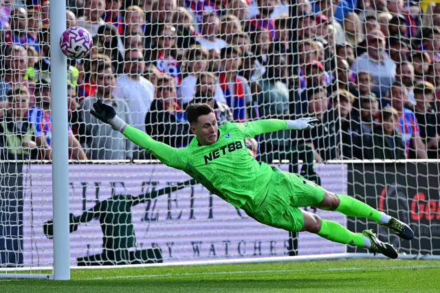 Crystal Palace's English goalkeeper #01 Dean Henderson makes a save during the English Premier League football match between Crystal Palace and Liverpool at Selhurst Park in south London on September 27, 2025.