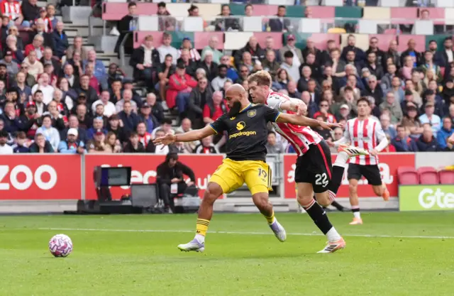 Manchester United's Bryan Mbeumo is fouled by Brentford's Nathan Collins