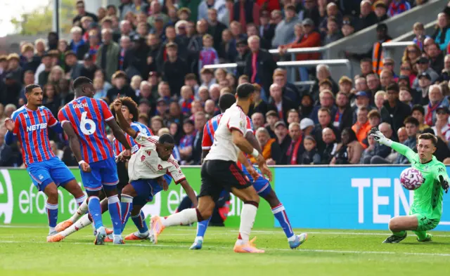 Liverpool's Alexander Isak in action with Crystal Palace's Dean Henderson