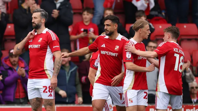 Ollie Palmer celebrates giving Swindon the lead