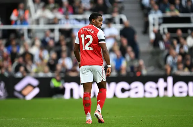 Jurrien Timber of Arsenal looks on