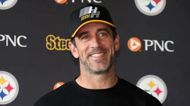 Pittsburgh quarterback Aaron Rodgers speaking at a news conference in Ireland