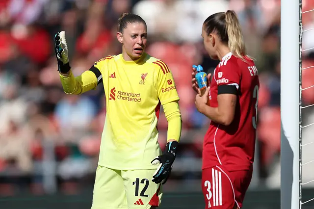 Rafaela Borggraefe and Gemma Evans of Liverpool talk during the Barclays Women's Super League match between Liverpool and Manchester United at Totally Wicked Stadium on September 28, 2025 in St Helens, England.