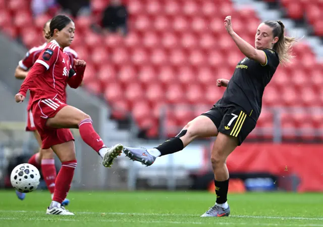 Manchester United's Ella Toone (right) attempts a shot toward goal during the Barclays Women's Super League match at the Totally Wicked Stadium, St Helens.