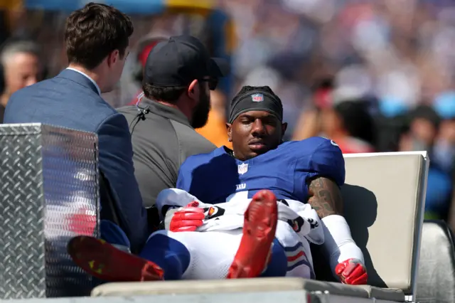 Malik Nabers #1 of the New York Giants reacts after being injured