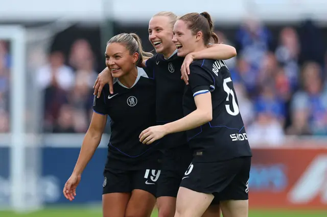 Aggie Beever-Jones of Chelsea celebrates scoring her team's first goal with teammates during the Barclays Women's Super League match between West Ham United and Chelsea FC at Chigwell Construction Stadium on September 28, 2025 in Dagenham, England.
