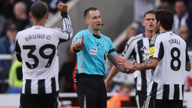 Referee Jarred Gillett reacts with Newcastle United's Sandro Tonali