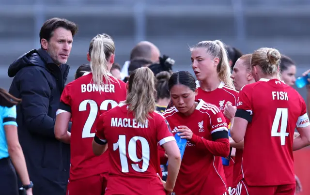 Liverpool manager Gareth Taylor talks to players during injury break