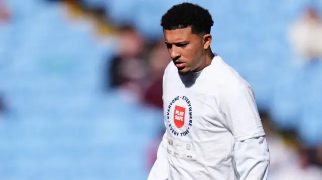 Jadon Sancho warms up
