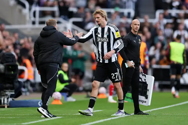 Eddie Howe, Manager of Newcastle United, greets Nick Woltemade