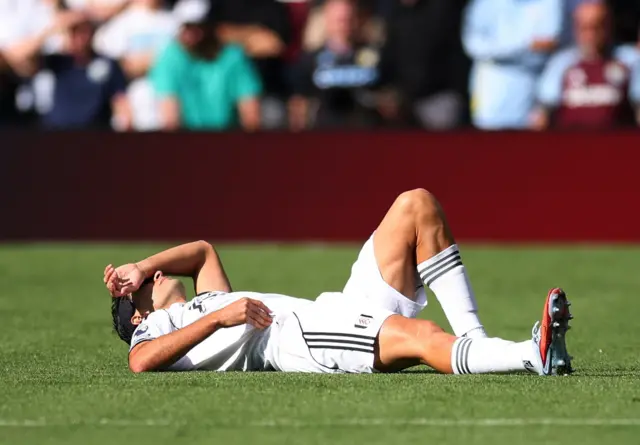 Raul Jimenez of Fulham down injured at Villa Park