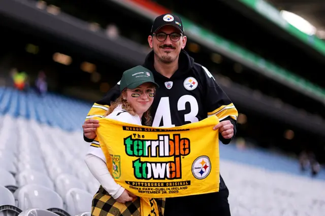 Steelers fans with a Terrible Towel