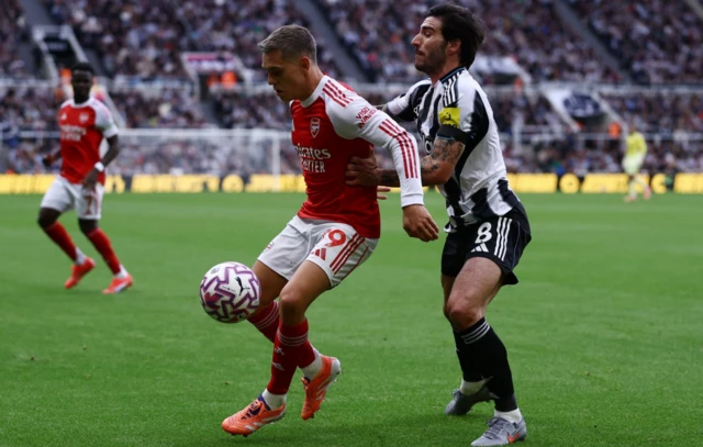 Arsenal's Leandro Trossard in action with Newcastle United's Sandro Tonali