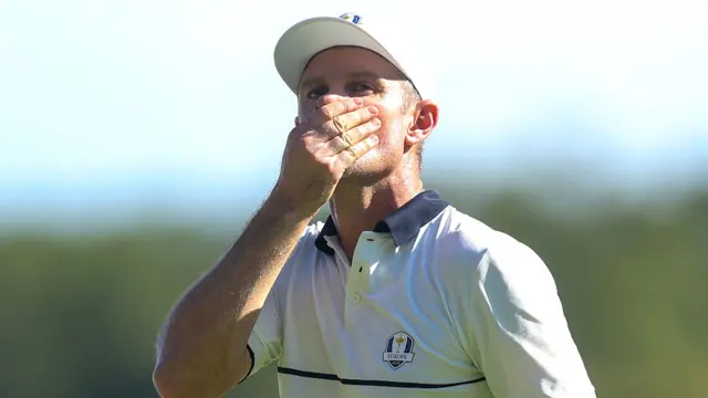 Justin Rose covers his mouth