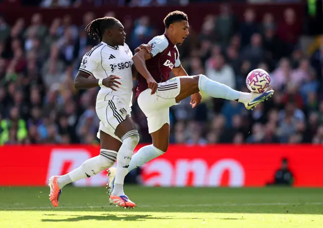 Ollie Watkins is challenged by Calvin Bassey as he scores for Aston Villa against Fulham