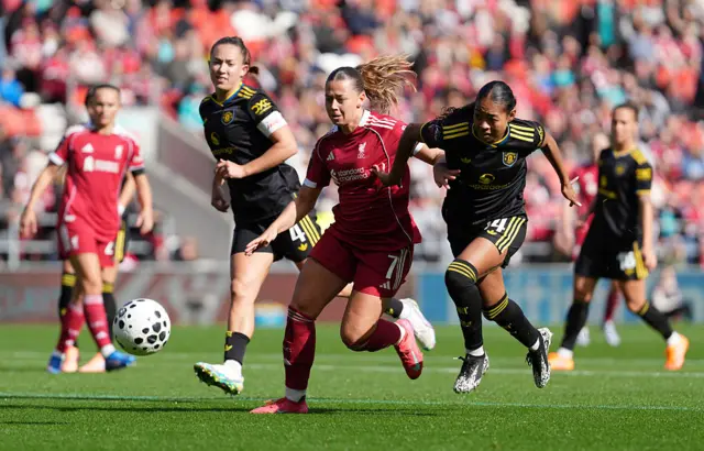 Cornelia Kapocs of Liverpool and Jayde Riviere of Manchester United battle for possession during the Barclays Women's Super League match between Liverpool and Manchester United at Totally Wicked Stadium on September 28, 2025 in St Helens, England.