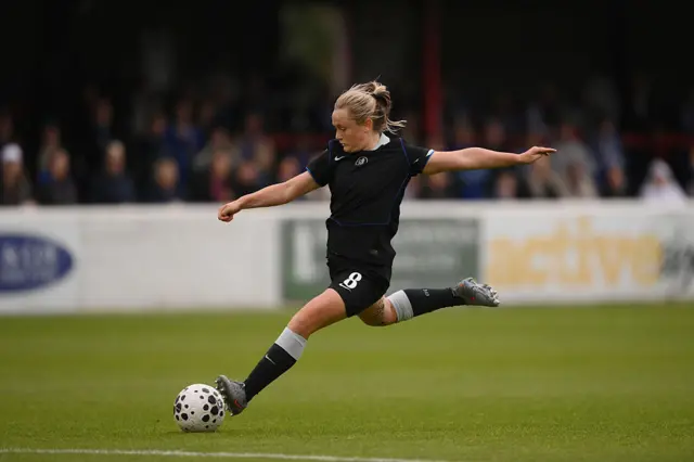 Erin Cuthbert of Chelsea scores her team's third goal during the Barclays Women's Super League match between West Ham United and Chelsea FC at Chigwell Construction Stadium on September 28, 2025 in Dagenham, England.