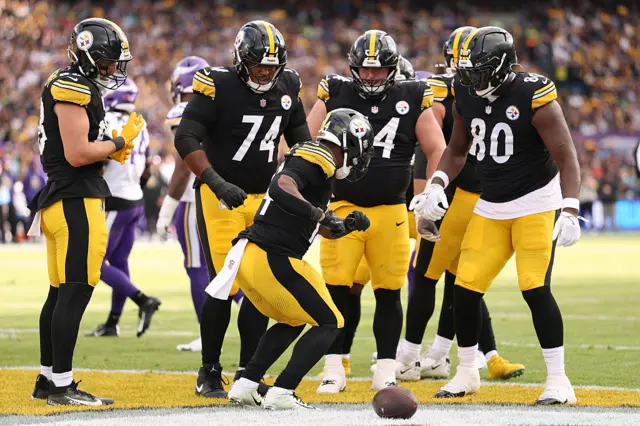 Kenneth Gainwell of Pittsburgh Steelers (#14) celebrates scoring a touchdown in the third quarter with teammates