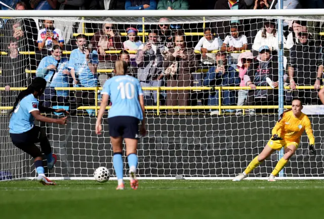 Manchester City's Khadija Shaw (left) scores her sides third goal from the penalty spot during the Barclays Women's Super League match at the Manchester City Joie Stadium.