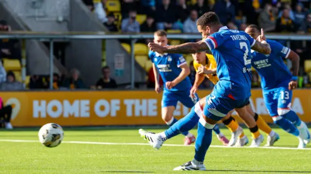 James Tavernier takes a penalty for Rangers, which is saved
