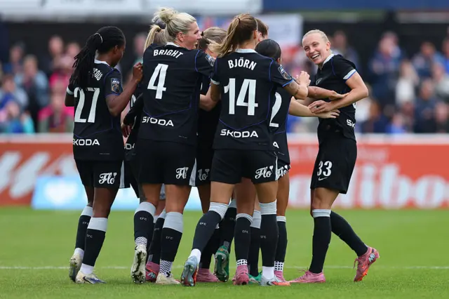 Aggie Beever-Jones of Chelsea celebrates scoring her team's first goal with teammates during the Barclays Women's Super League match between West Ham United and Chelsea FC at Chigwell Construction Stadium on September 28, 2025 in Dagenham, England.