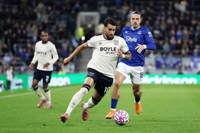 Lucas Paqueta of West Ham United runs with the ball whilst under pressure from Jack Grealish of Everton during the Premier League match between Everton and West Ham United at Hill Dickinson Stadium on September 29, 2025 in Liverpool, England.