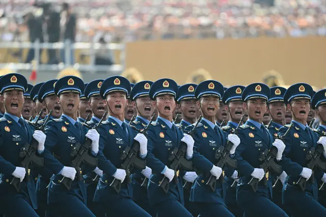 Chinese troops march during a military parade