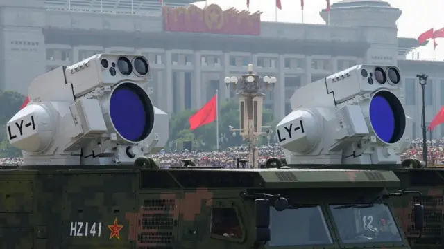 Two air-defence lasers pointing to the sky