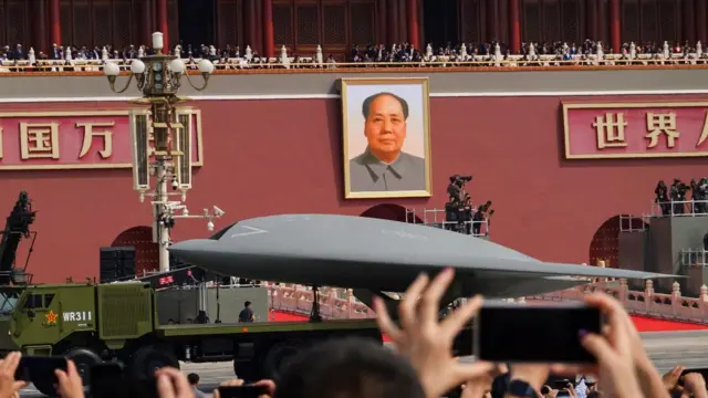 A drone is displayed in front of a crowd in Beijing
