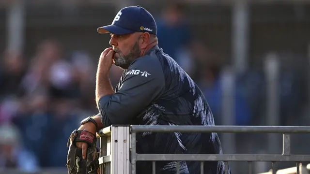 Darren Lehmann watching Northants from a balcony