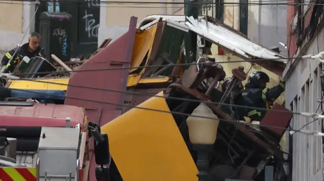 Yellow and red wreckage piled high in a european street