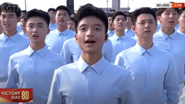 Men in collared shirts singing