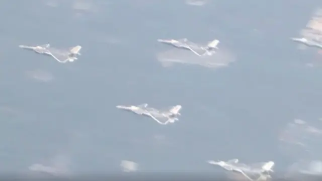 Aerial formation fly past central Beijing