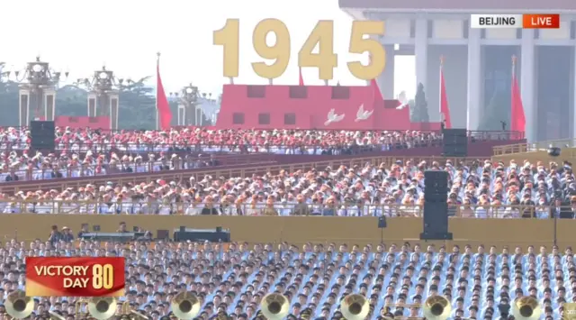 People standing in rows in Tiananmen square