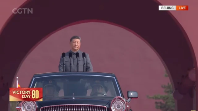 Xi Jinping above black car
