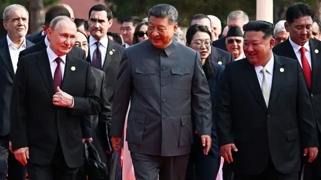 Putin, Xi and Kim walk at the military parade