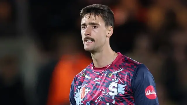 George Scrimshaw celebrates