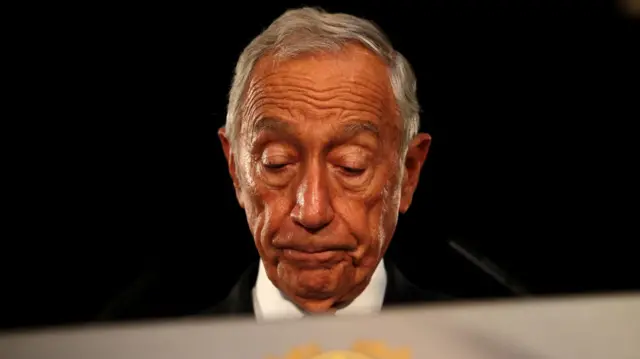 Portugal's President Marcelo Rebelo de Sousa looks down