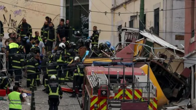 Dozens of emergency service responders among red and yellow wreckage piled high