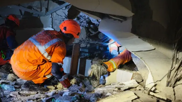 Large concrete slabs are hindering search efforts