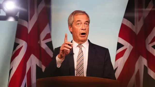 Reform UK leader Nigel Farage reacts to the speech by Prime Minister Sir Keir Starmer