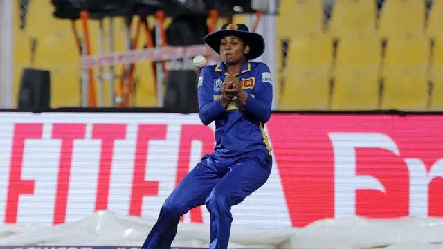 Vishmi Gunaratne of Sri Lanka takes the catch to dismiss Pratika Rawal of India